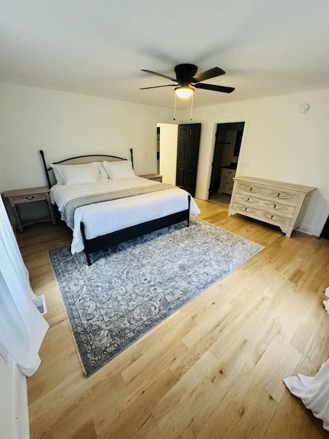 bedroom featuring ceiling fan and light hardwood / wood-style floors