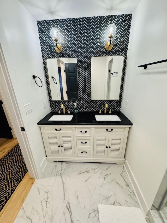 bathroom with decorative backsplash and vanity