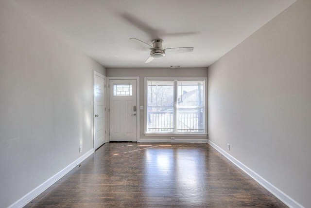 interior space with ceiling fan and dark hardwood / wood-style flooring