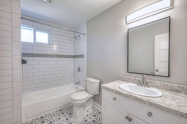 full bathroom with toilet, tiled shower / bath combo, tile patterned floors, and vanity