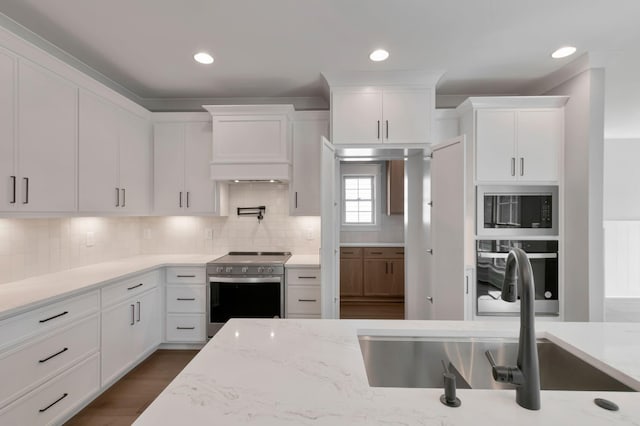 3025 Shady Forest Dr, Murfreesboro, TN 37128 - kitchen featuring custom exhaust hood, a sink, white cabinets, backsplash, and appliances with stainless steel finishes