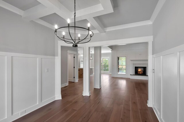 3025 Shady Forest Dr, Murfreesboro, TN 37128 - unfurnished dining area with dark wood-style flooring, a decorative wall, beam ceiling, and a notable chandelier