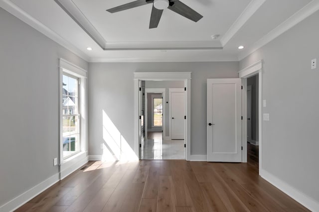 3025 Shady Forest Dr, Murfreesboro, TN 37128 - spare room with wood finished floors, baseboards, a ceiling fan, and a tray ceiling