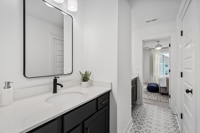 bathroom with ceiling fan and vanity