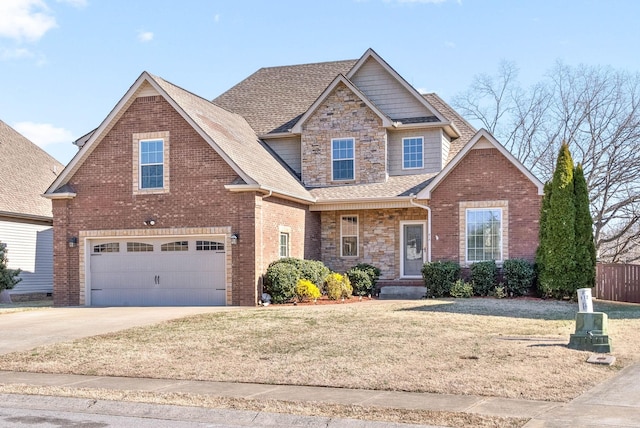 view of front of property with a garage and a front yard