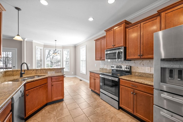 kitchen with light tile patterned flooring, appliances with stainless steel finishes, decorative light fixtures, sink, and light stone countertops