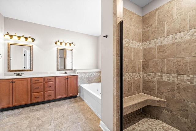 bathroom with vanity and independent shower and bath