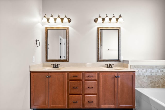 bathroom with vanity and a bath