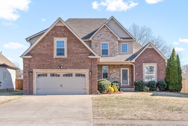 view of front of house featuring a garage and a front lawn