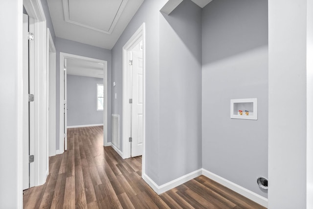 hallway with dark hardwood / wood-style flooring