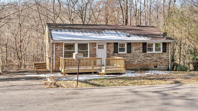 view of front of home featuring a wooden deck