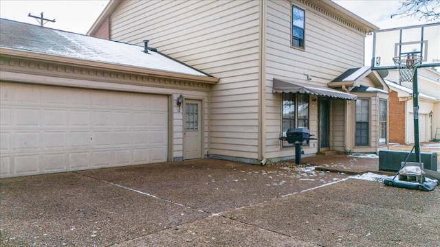 view of property exterior featuring a garage