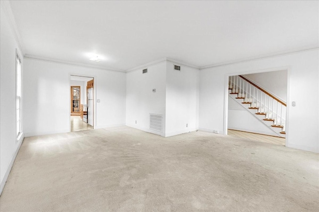 unfurnished living room featuring carpet floors and crown molding