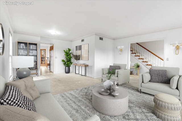 living room featuring light colored carpet and crown molding