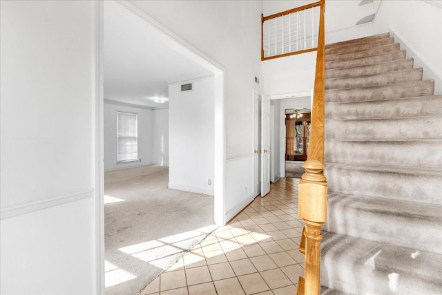 foyer with light colored carpet