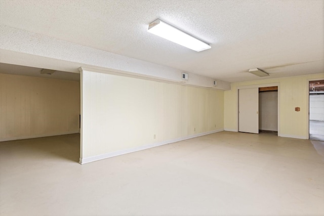 basement with a textured ceiling