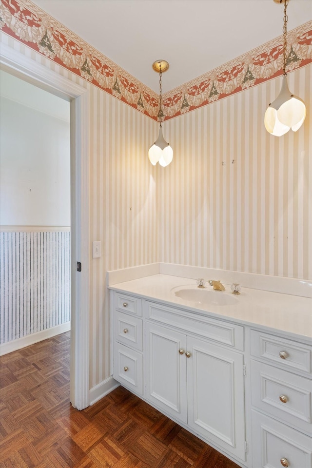 bathroom with vanity and parquet floors