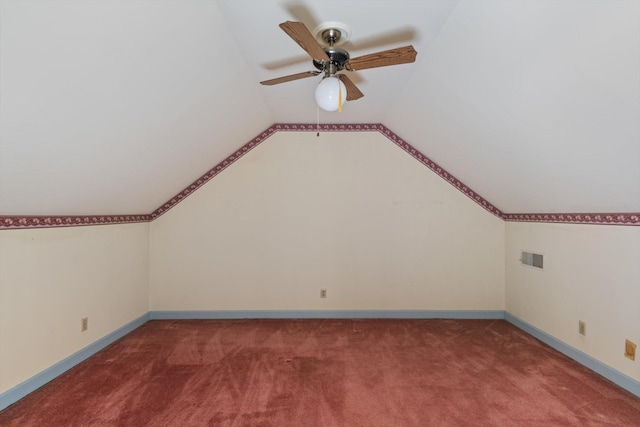 additional living space featuring ceiling fan, carpet, and lofted ceiling