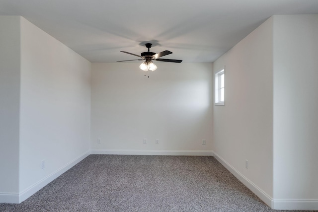 unfurnished room featuring ceiling fan and carpet floors