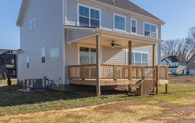 back of house with ceiling fan, central AC, a lawn, and a deck