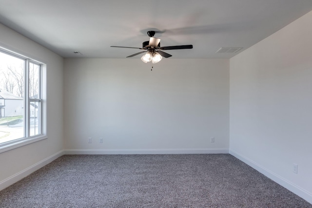 unfurnished room featuring ceiling fan and carpet flooring