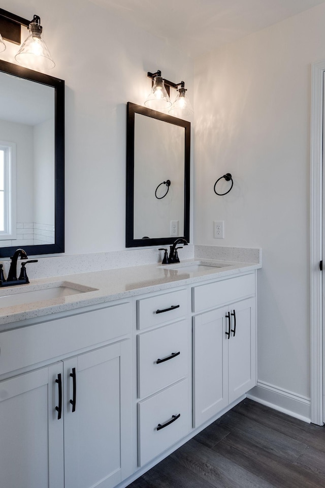 bathroom featuring hardwood / wood-style flooring and vanity