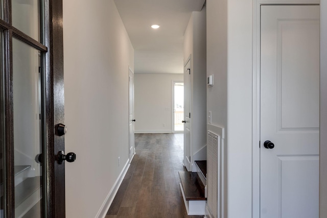 hallway featuring dark hardwood / wood-style flooring