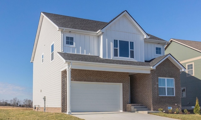 view of front of home with a garage and a front lawn