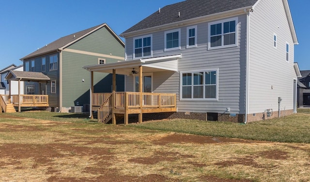 back of property with ceiling fan, cooling unit, a lawn, and a deck