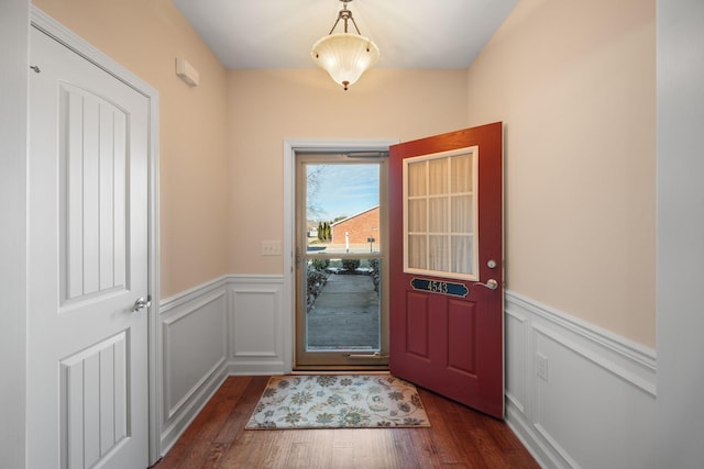 doorway to outside with dark wood-type flooring