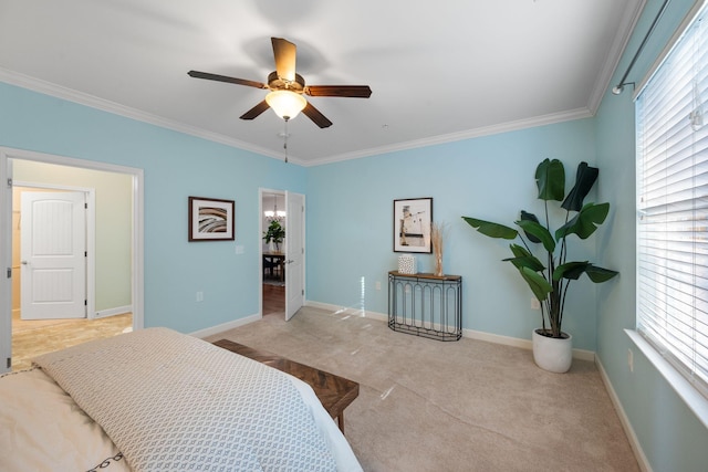 carpeted bedroom with crown molding and ceiling fan