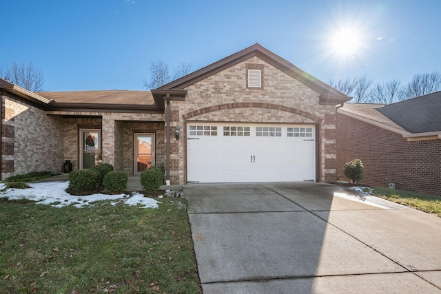 ranch-style house featuring a garage and a front yard