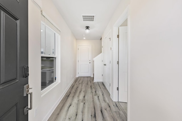 corridor featuring light wood-type flooring