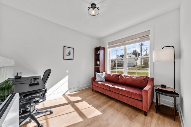 office with light hardwood / wood-style floors