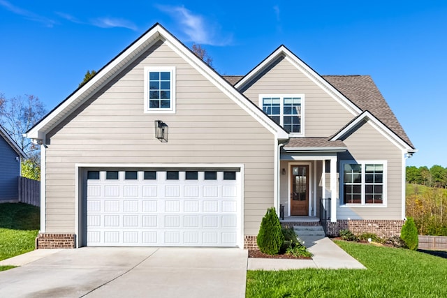 view of front facade with a garage and a front lawn