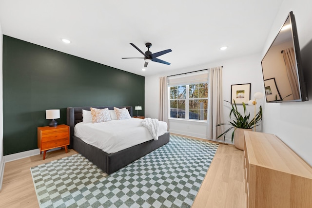 bedroom featuring ceiling fan and light wood-type flooring