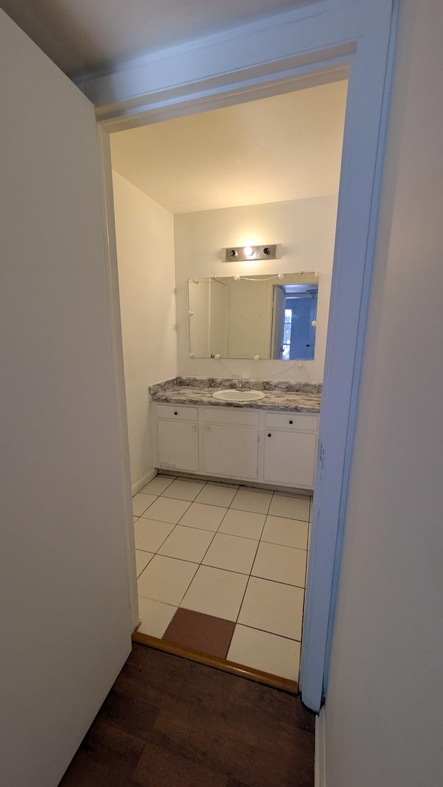 bathroom featuring wood-type flooring and vanity