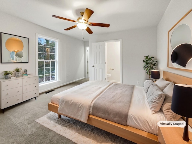 carpeted bedroom featuring ceiling fan and connected bathroom