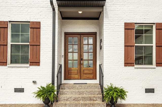 property entrance featuring french doors