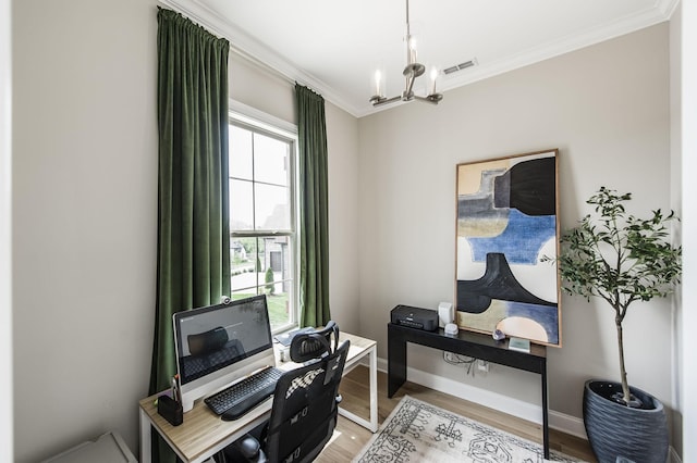 office with wood-type flooring, a notable chandelier, and ornamental molding