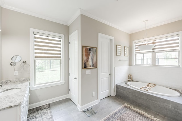 bathroom with a wealth of natural light, tiled tub, vanity, and ornamental molding