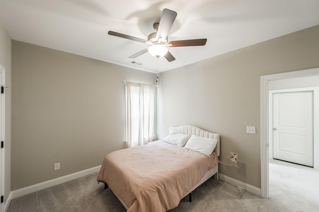 bedroom featuring light carpet and ceiling fan