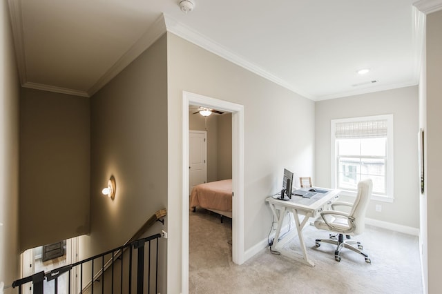 carpeted office space with ceiling fan and ornamental molding