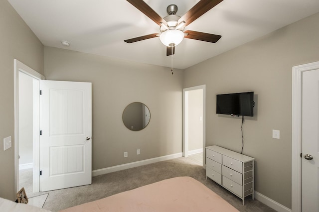 bedroom featuring ceiling fan and light carpet