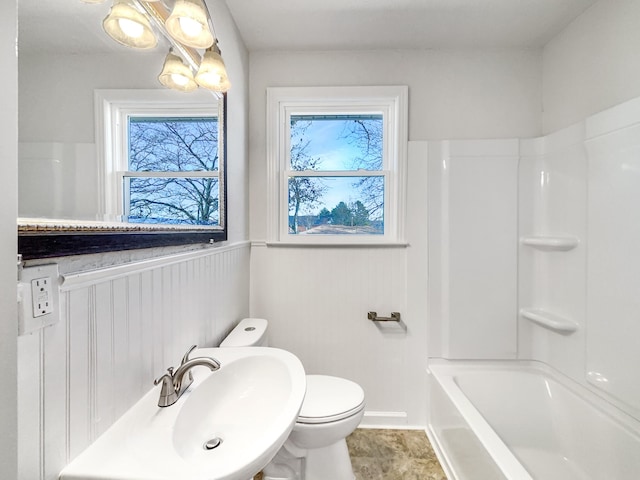 full bathroom with sink, washtub / shower combination, and toilet