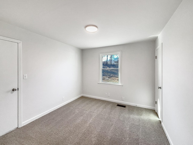 unfurnished room featuring carpet floors