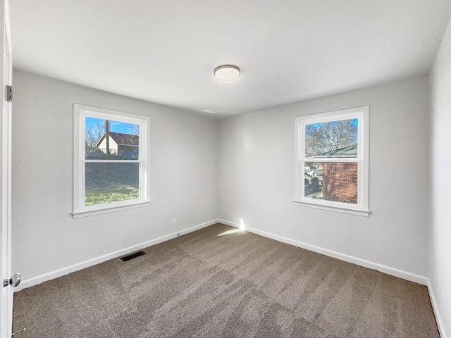 empty room featuring carpet floors