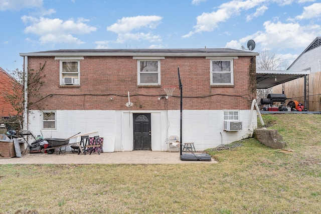 back of property featuring a patio and a yard