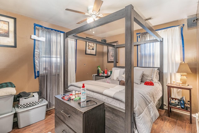 bedroom featuring hardwood / wood-style floors and ceiling fan