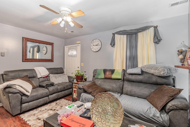 living room featuring ceiling fan and wood-type flooring